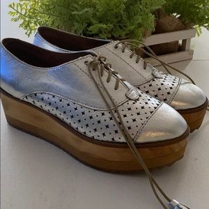 Silver high sole shoes